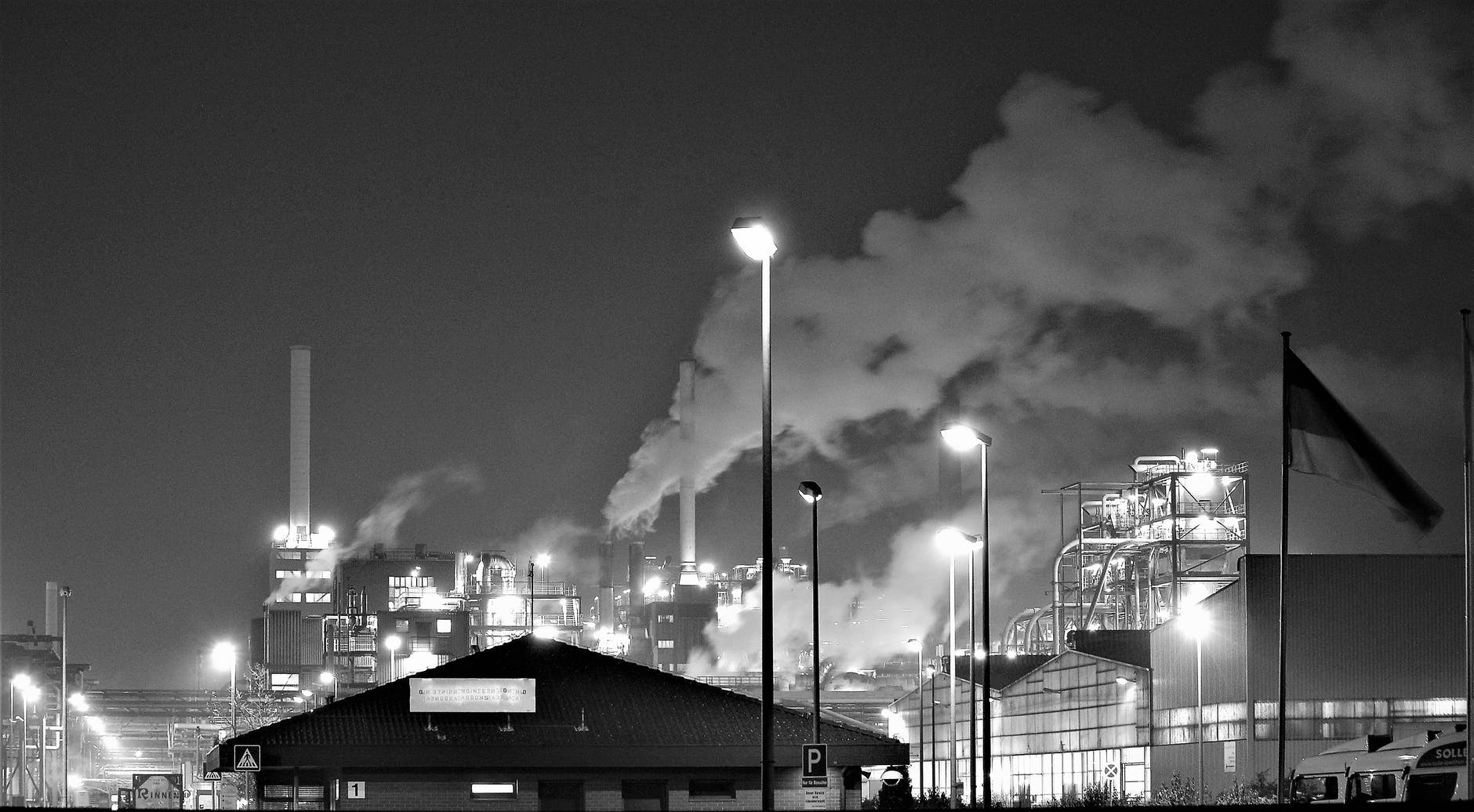 grayscale photography of a factory