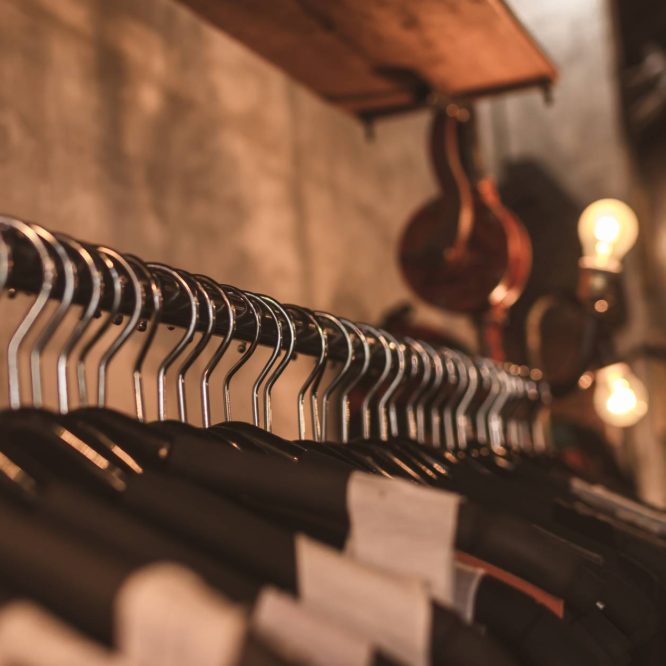 photo of black clothes on hangers